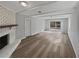 Bright living room with a brick fireplace and sliding glass doors to the backyard at 332 Hickory Acres Se Dr, Smyrna, GA 30082