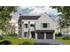 A stunning two-story home with a stone facade, dark grey garage doors, manicured lawn, and professional landscaping at 140 Lake Estates Dr, Roswell, GA 30075