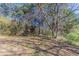 Spacious backyard features a wooded perimeter offering natural privacy at 5876 Old Wellborn Trce, Lithonia, GA 30058