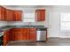 Kitchen with dark cabinets, modern appliances, granite counters, and hardwood floors at 5876 Old Wellborn Trce, Lithonia, GA 30058