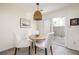 Cozy breakfast nook with a rustic wood table and sliding door to the patio at 834 Heritage Sq, Decatur, GA 30033