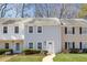 Charming townhouse with manicured lawn and inviting front walkway at 834 Heritage Sq, Decatur, GA 30033