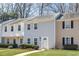 Well-maintained townhouse featuring a bright exterior and lush green lawn at 834 Heritage Sq, Decatur, GA 30033