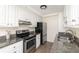 Updated kitchen offers stainless steel appliances and granite countertops at 834 Heritage Sq, Decatur, GA 30033