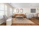 Elegant living room with hardwood floors, comfortable seating, and stylish wall art at 834 Heritage Sq, Decatur, GA 30033