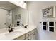 Bathroom featuring double vanity with modern fixtures and a large mirror at 1148 Burlington Ct, Mcdonough, GA 30253