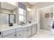 Elegant bathroom with double vanity, modern fixtures, and stylish tile flooring at 1148 Burlington Ct, Mcdonough, GA 30253