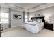 Serene main bedroom showcases tray ceilings, soft carpet, and plenty of natural light at 1148 Burlington Ct, Mcdonough, GA 30253