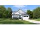 Charming two-story home with a well-manicured lawn, attached garage, and attractive stone accents at 1148 Burlington Ct, Mcdonough, GA 30253