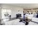 Open-concept living area with access to the porch, features modern décor and comfortable seating at 1148 Burlington Ct, Mcdonough, GA 30253
