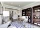 Inviting home office space featuring hardwood floors, custom shelving, and a comfortable layout at 1148 Burlington Ct, Mcdonough, GA 30253