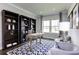 Stylish home office features custom built-in shelving, a large window, and modern decor at 1148 Burlington Ct, Mcdonough, GA 30253