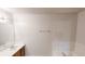 This bathroom has a bathtub with a tiled wall and a vanity with wood cabinets at 1198 Oak Knoll Ct, Lithonia, GA 30058
