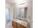 Bathroom featuring single sink, granite countertop, and a large mirror at 1198 Oak Knoll Ct, Lithonia, GA 30058