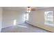 This bedroom has a ceiling fan and two large windows to let in plenty of natural light at 1198 Oak Knoll Ct, Lithonia, GA 30058