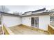 Wooden deck overlooking the property with railings and a sliding glass door at 1198 Oak Knoll Ct, Lithonia, GA 30058