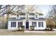 Charming two-story home featuring a well-maintained yard and classic architectural details at 1198 Oak Knoll Ct, Lithonia, GA 30058