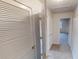 Hallway view with closet space and views into other rooms of the property at 1198 Oak Knoll Ct, Lithonia, GA 30058
