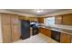 Functional kitchen with essential appliances, ample cabinetry, and a window over the sink at 1198 Oak Knoll Ct, Lithonia, GA 30058