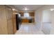 Functional kitchen with essential appliances, ample cabinetry, and tile flooring at 1198 Oak Knoll Ct, Lithonia, GA 30058