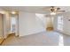 Open-concept room has carpet, lots of light, and a staircase to the second floor at 1198 Oak Knoll Ct, Lithonia, GA 30058
