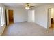 This large main bedroom has a ceiling fan, carpeted floor and ensuite bath and walk-in closet at 1198 Oak Knoll Ct, Lithonia, GA 30058