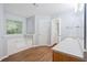 This spacious bathroom includes a soaking tub and a wooden vanity with a white countertop at 4156 Holly Springs Rd, Rockmart, GA 30153