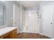 Bathroom featuring a tiled shower, wooden vanity, and neutral walls with great natural light at 4156 Holly Springs Rd, Rockmart, GA 30153