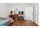 Bedroom boasting hardwood floors, neutral walls, and a large closet with natural light at 4156 Holly Springs Rd, Rockmart, GA 30153
