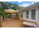 Outdoor wooden deck with gazebo and lounge chair offers a relaxing space adjacent to the home, with views of the backyard at 4156 Holly Springs Rd, Rockmart, GA 30153