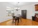 Bright dining area with hardwood floors, natural light, and access to the backyard at 4156 Holly Springs Rd, Rockmart, GA 30153