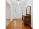 Bright entryway featuring hardwood floors and a classic dresser, creating a warm and inviting atmosphere at 4156 Holly Springs Rd, Rockmart, GA 30153