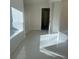 A full bathroom featuring both a bathtub and shower, with light shining on the tile floor at 72 Dodd Rd, Kingston, GA 30145