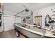 Well-organized garage with a boat, storage racks, and motorized lift at 100 Summer Breeze Ln, Canton, GA 30114