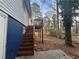 The backyard features a wood deck with stairs and a large yard with mature trees, offering outdoor enjoyment at 3900 Boulder Park Sw Dr, Atlanta, GA 30331