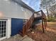 The backyard features a wood deck with stairs and a large yard with mature trees, offering outdoor enjoyment at 3900 Boulder Park Sw Dr, Atlanta, GA 30331