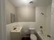 The full bathroom features a shower-tub combo with white tile surround and a modern vanity with a single sink at 3900 Boulder Park Sw Dr, Atlanta, GA 30331