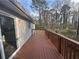 A spacious wood deck offers a perfect outdoor space for relaxation, enjoying backyard views and ample sunlight at 3900 Boulder Park Sw Dr, Atlanta, GA 30331