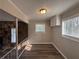 Inviting dining area with stone accent wall, large windows, and staircase at 3900 Boulder Park Sw Dr, Atlanta, GA 30331