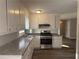 Functional kitchen featuring a stainless steel oven, ample counter space, and modern finishes at 3900 Boulder Park Sw Dr, Atlanta, GA 30331