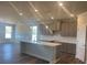 Modern kitchen boasts an island, granite countertops, stainless appliances, and ample storage space at 822 Kestrel Dr, Loganville, GA 30052
