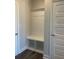 Convenient mudroom with a built-in bench, shelving, and storage, perfect for organizing shoes and coats at 822 Kestrel Dr, Loganville, GA 30052
