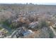 Aerial view of the home, highlighted by a red outline, in a neighborhood with mature trees, and city skyline at 2983 Crosswycke Forest Ne Dr # A, Atlanta, GA 30319