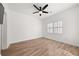 This minimalist bedroom features wood floors, a ceiling fan and bright, neutral paint at 2983 Crosswycke Forest Ne Dr # A, Atlanta, GA 30319