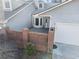 Charming front entrance with brick privacy wall and bay window, leading to the front door and attached garage at 2983 Crosswycke Forest Ne Dr # A, Atlanta, GA 30319
