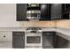 Gourmet kitchen with stainless steel appliances, including a gas range and a microwave oven at 2983 Crosswycke Forest Ne Dr # A, Atlanta, GA 30319