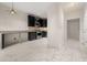 Kitchenette featuring stainless steel appliances and granite countertops, perfect for cooking at 2983 Crosswycke Forest Ne Dr # A, Atlanta, GA 30319