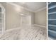 Bright living room with white marble floors leads to shelving at 2983 Crosswycke Forest Ne Dr # A, Atlanta, GA 30319
