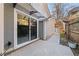 Back patio with awning, sliding glass doors to the home's interior, and a walkway leading to backyard at 2983 Crosswycke Forest Ne Dr # A, Atlanta, GA 30319