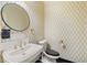 Elegant powder room with wallpaper, modern fixtures, and vanity at 2983 Crosswycke Forest Ne Dr # A, Atlanta, GA 30319